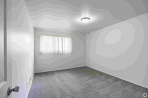 Fraser apartment for rent - A room with a door, a window with blinds, and a ceiling light.