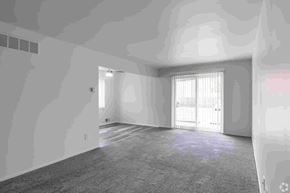 Fraser apartment for rent - A room with a carpeted floor and a window with blinds.