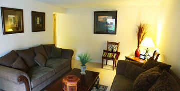 Spokane apartment for rent - a living room with couches and a coffee table
