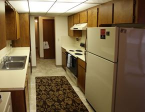 Spokane apartment for rent - a kitchen with a refrigerator and a sink