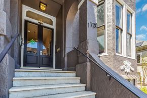 San Francisco apartment for rent - The front steps of a building with a black door and a sign that reads "1720".