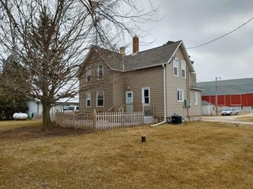 Port Washington apartment for rent - a house with a fenced in yard and a red barn