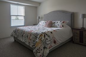 Grand Rapids apartment for rent - a bedroom with a bed and a dresser and a window