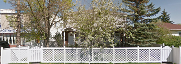 Calgary house for rent - a white fence in front of a house