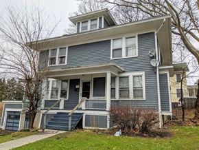 Ithaca apartment for rent - A blue two-story house with a white door and windows.