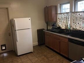 Ithaca apartment for rent - A white fridge in a kitchen with a tiled floor.
