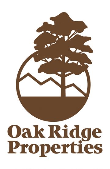 Springfield apartment for rent - a logo properties with a tree and mountains