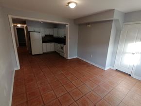Hamilton apartment for rent - an empty kitchen and living room with a tiled floor
