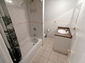 Hamilton apartment for rent - a small bathroom with a shower and a sink