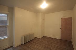 Pittsburgh apartment for rent - the living room of an empty house with a wood floor