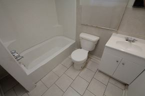 Pittsburgh apartment for rent - a bathroom with a toilet and a tub and a sink