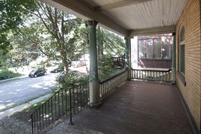 Pittsburgh apartment for rent - a front porch with a view of a street and trees