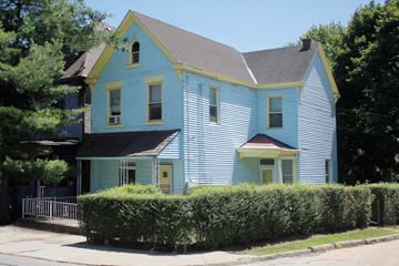 Pittsburgh apartment for rent - A blue house with a yellow trim.
