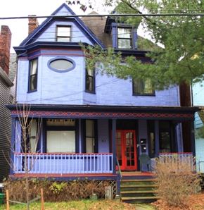 Pittsburgh apartment for rent - A blue house with a red door and a porch.