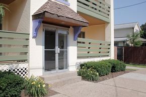 Pittsburgh apartment for rent - A house with a brown awning over a glass door.