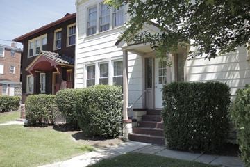 Pittsburgh apartment for rent - A white house with a red door and a brown house with a white door.