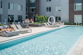 Cleveland apartment for rent - Quarter residents enjoy a heated zero-edge pool with cabanas and grills on a raised deck