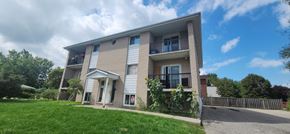 Waterloo apartment for rent - A two-story apartment building with a balcony on the second floor.