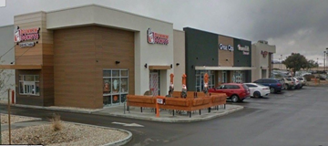 Kingman apartment for rent - a shopping center with cars parked in front of it