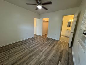 St Petersburg apartment for rent - a living room with wood floors and a ceiling fan