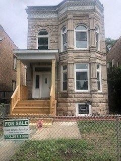 Chicago apartment for rent - a house with a for sale sign in front of it