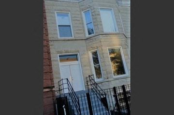 Chicago apartment for rent - A building with a white door and windows.