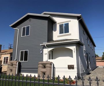 Los Angeles apartment for rent - A two-story house with a grey exterior and white trim.