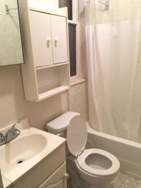 Kitchener apartment for rent - a white bathroom with a toilet and a sink