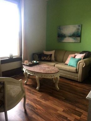 Kitchener apartment for rent - a living room with a couch and a table