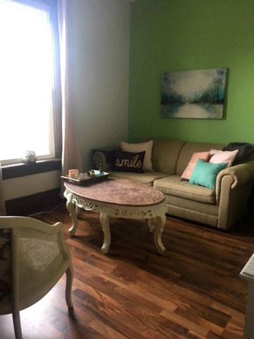 Kitchener apartment for rent - a living room with a couch and a table