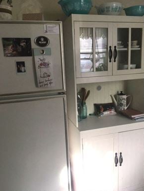 Kitchener apartment for rent - a kitchen with a refrigerator and white cabinets