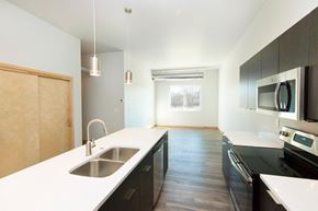 South Sioux City apartment for rent - an empty kitchen with a sink and a counter top