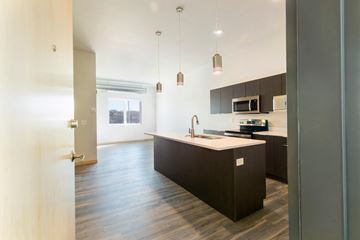 South Sioux City apartment for rent - an empty kitchen with a large island in the middle