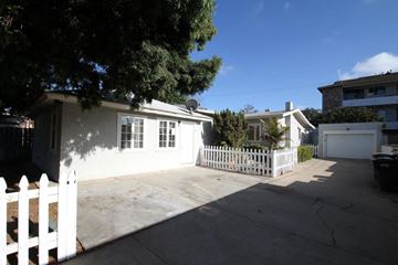 Chula Vista apartment for rent - a white house with a driveway and a white fence