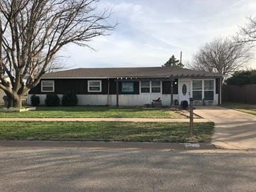 Snyder house for rent - a white and black house with a yard and a tree