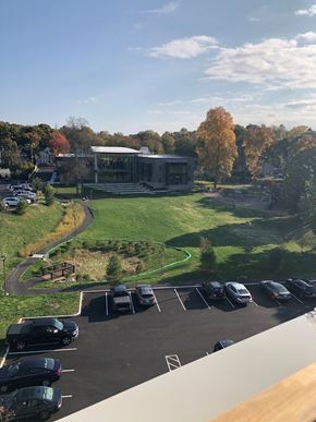 Weymouth apartment for rent - a view of a parking lot and a building from a balcony