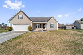 Richlands house for rent - the front of a house with a lawn and a driveway