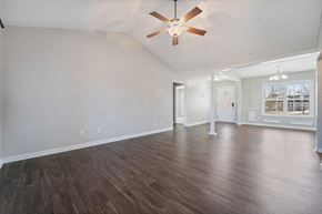 Richlands house for rent - a living room with white walls and a ceiling fan