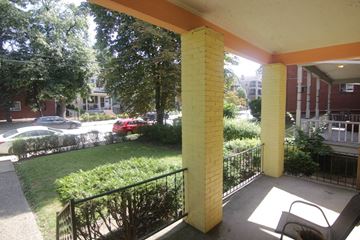 Pittsburgh apartment for rent - a view of the yard from the porch of an apartment building