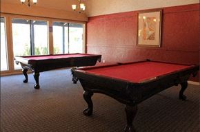 Reno apartment for rent - two pool tables in a room with red pool tables
