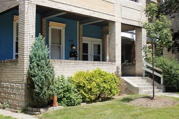 Pittsburgh apartment for rent - A house with a blue door and a window with a number 435 on it.