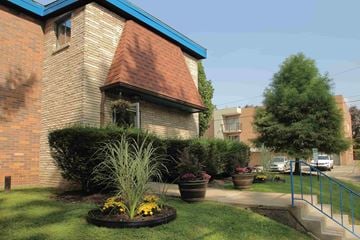 Pittsburgh apartment for rent - a house with a garden in front of it