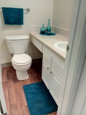 Portland apartment for rent - A white toilet sits next to a sink in a small bathroom.