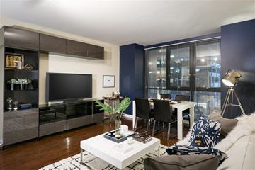 Los Angeles apartment for rent - A modern living room with a white coffee table and a grey couch.
