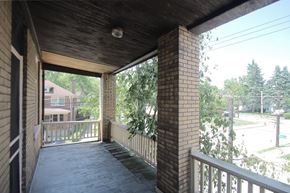 Pittsburgh apartment for rent - A balcony with a brick pillar and a wooden ceiling.