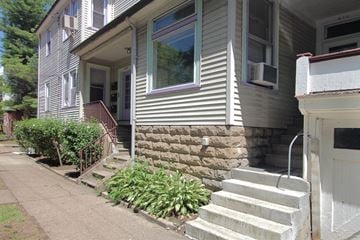 Pittsburgh apartment for rent - A house with a white door and a small porch.