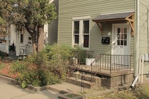 Pittsburgh apartment for rent - the front of a house with a porch and a white door