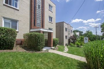 Pittsburgh apartment for rent - A residential building with a green lawn in front.