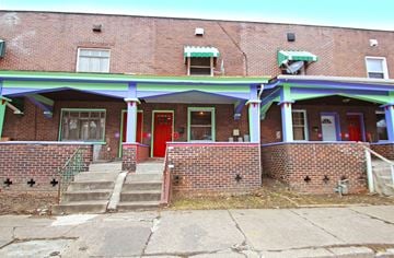 Pittsburgh apartment for rent - A red door is on the left side of the building.