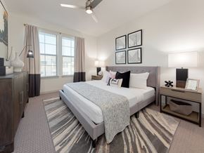 San Antonio apartment for rent - A bedroom with a large bed and a ceiling fan.